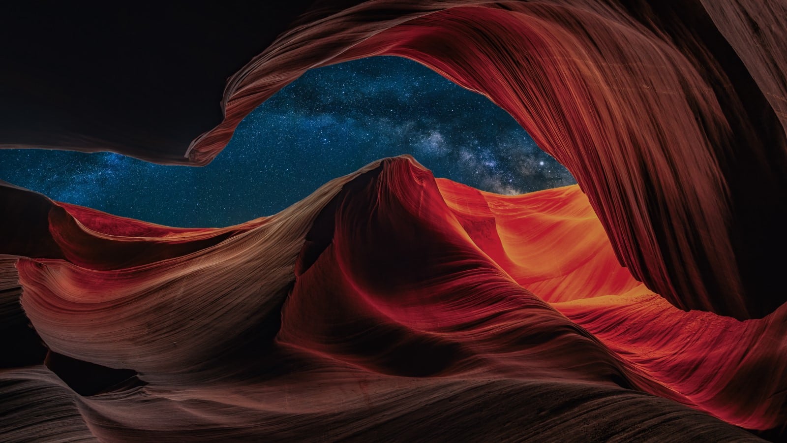 Antelope Canyon at night with a beautiful starry sky at night with the galaxy in the background